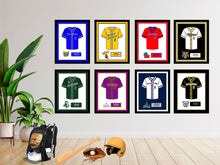 Load image into Gallery viewer, a group of framed pictures of baseball uniforms on a wall