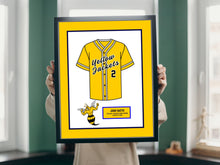 Load image into Gallery viewer, a person holding a framed picture of a baseball uniform